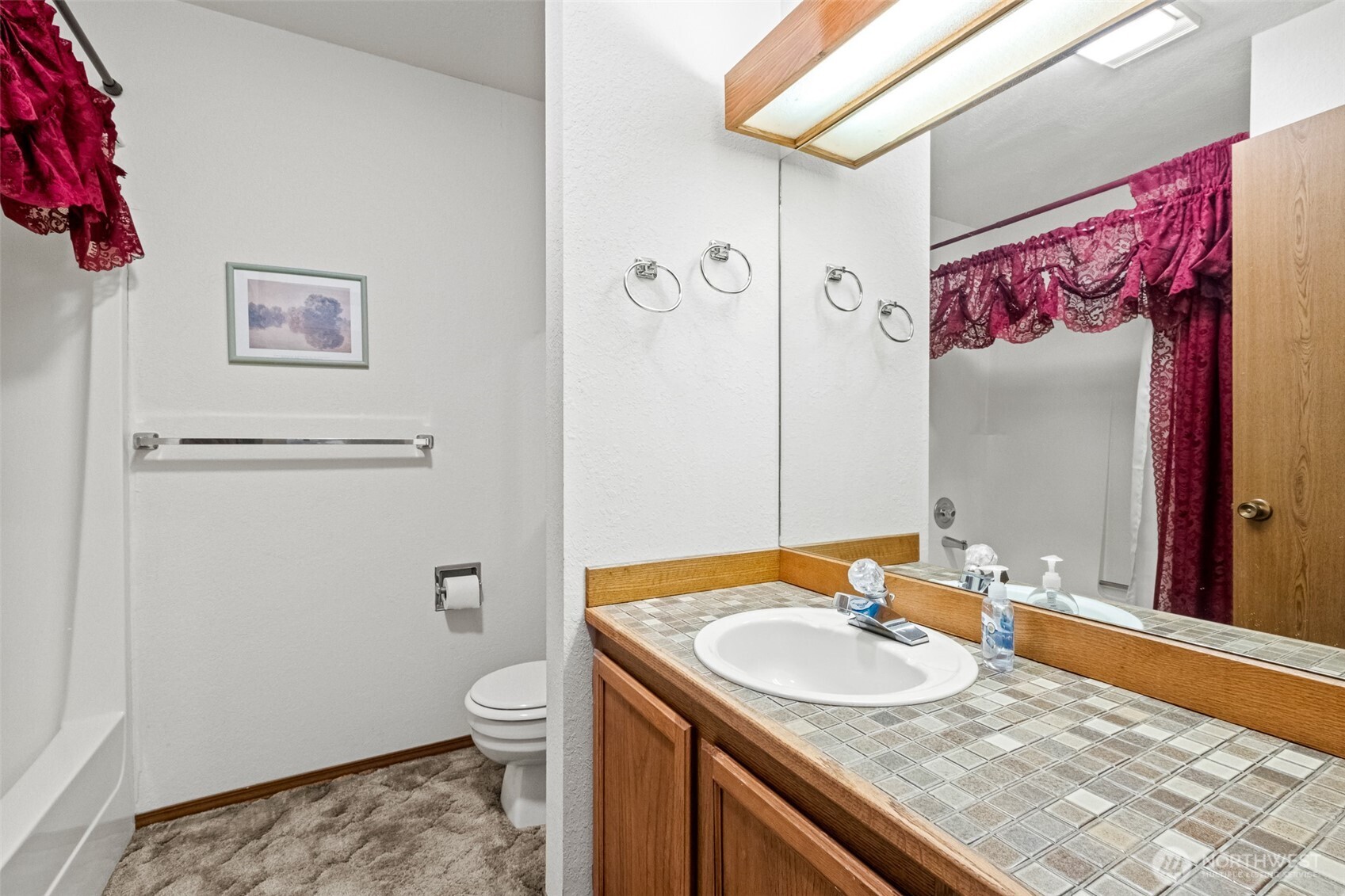 110 Icicle Road, Unit K Leavenworth, WA 98826 - Photo 17 of 26 a bathroom with a granite countertop sink toilet and shower