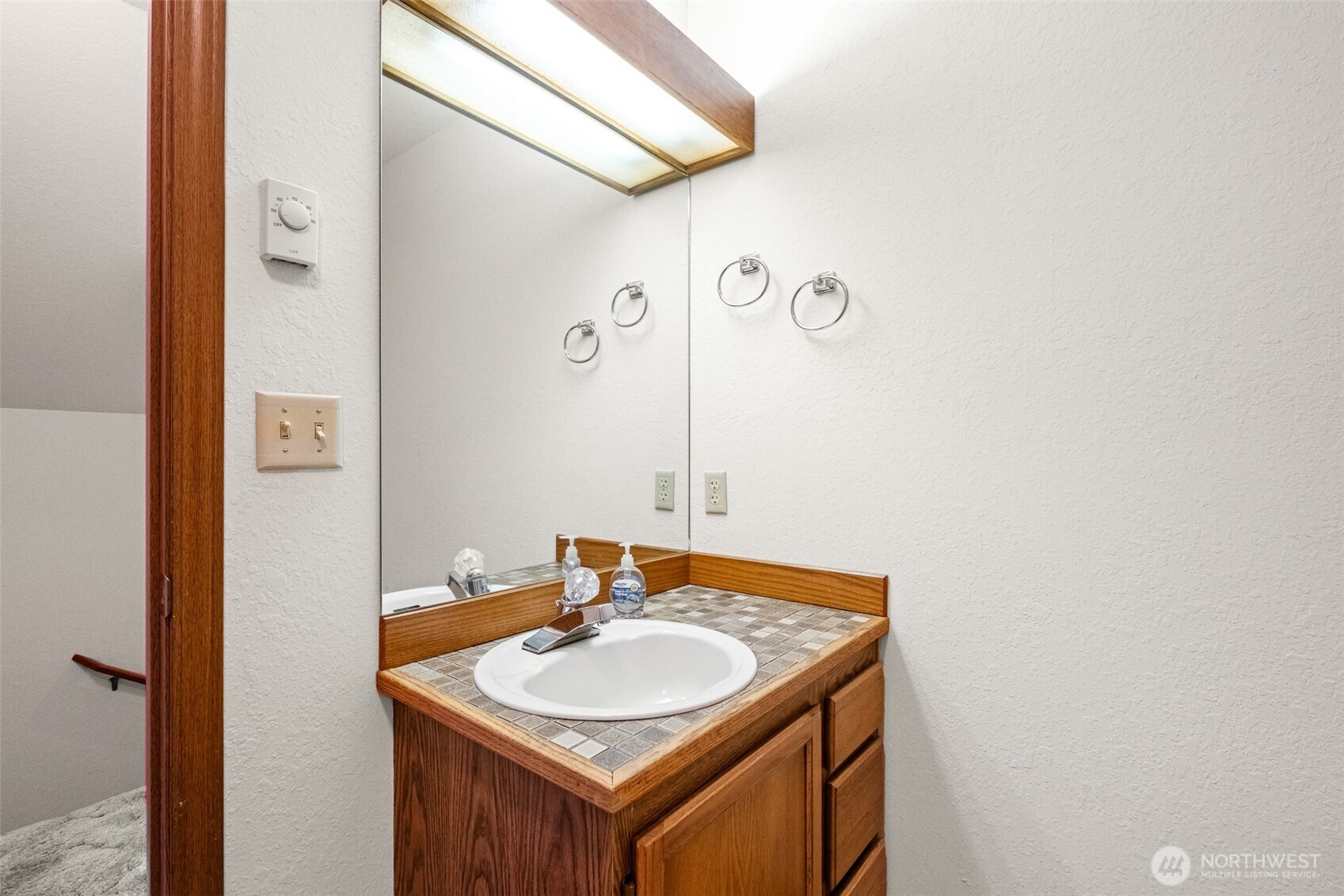 110 Icicle Road, Unit K Leavenworth, WA 98826 - Photo 22 of 26 a bathroom with a sink and a mirror