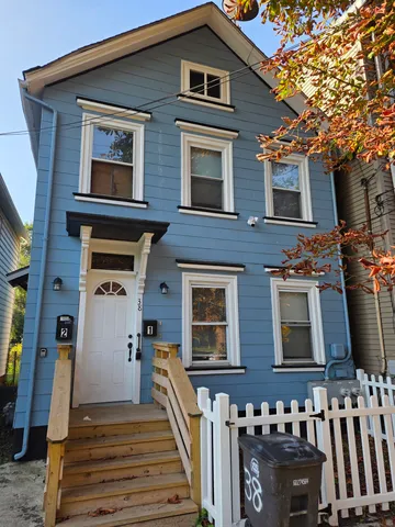 a front view of a house with stairs