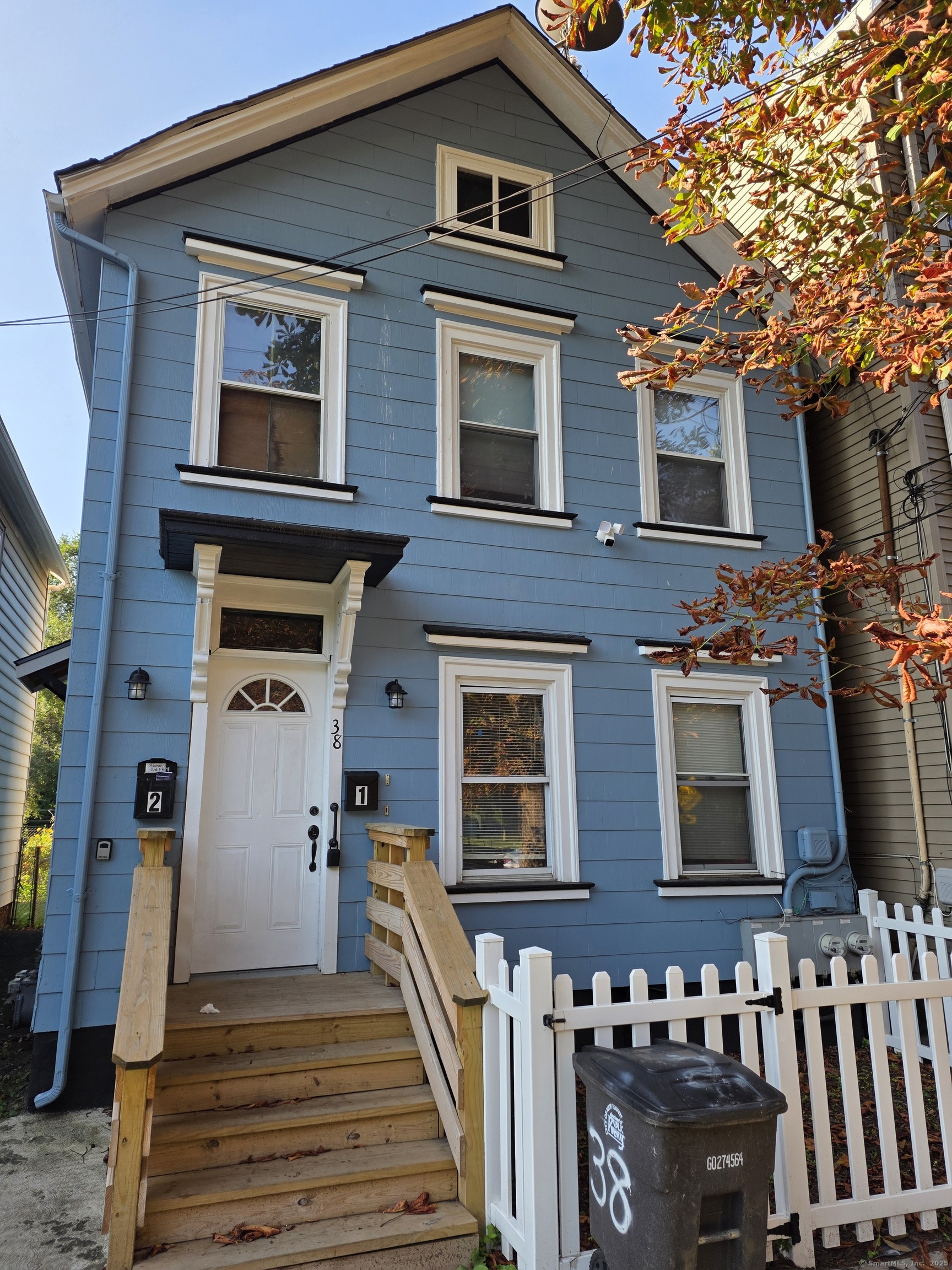 38 Walnut Street New Haven, CT 06511 - Photo 1 of 8 a front view of a house with stairs