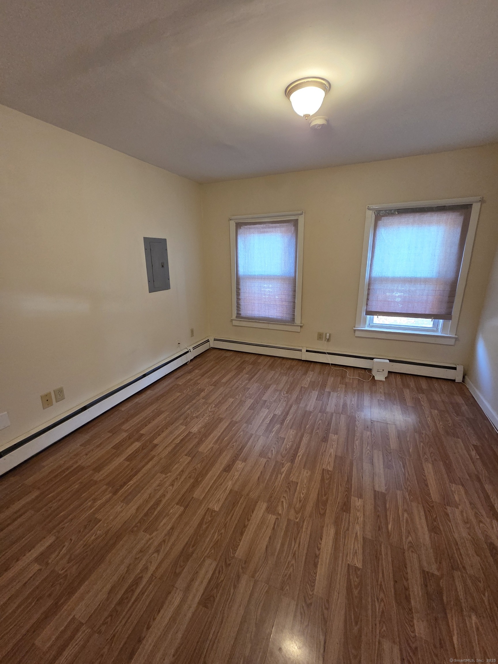 38 Walnut Street New Haven, CT 06511 - Photo 7 of 8 an empty room with wooden floor and windows