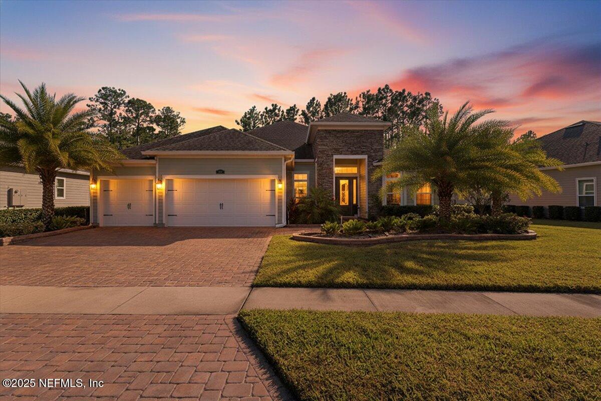 483 St Kitts Loop St. Augustine, FL 32092 - Photo 1 of 52 a front view of a house with a yard and garage