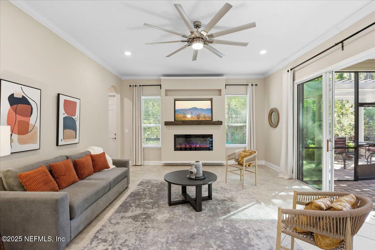 483 St Kitts Loop St. Augustine, FL 32092 - Photo 17 of 52 a living room with furniture and a fireplace