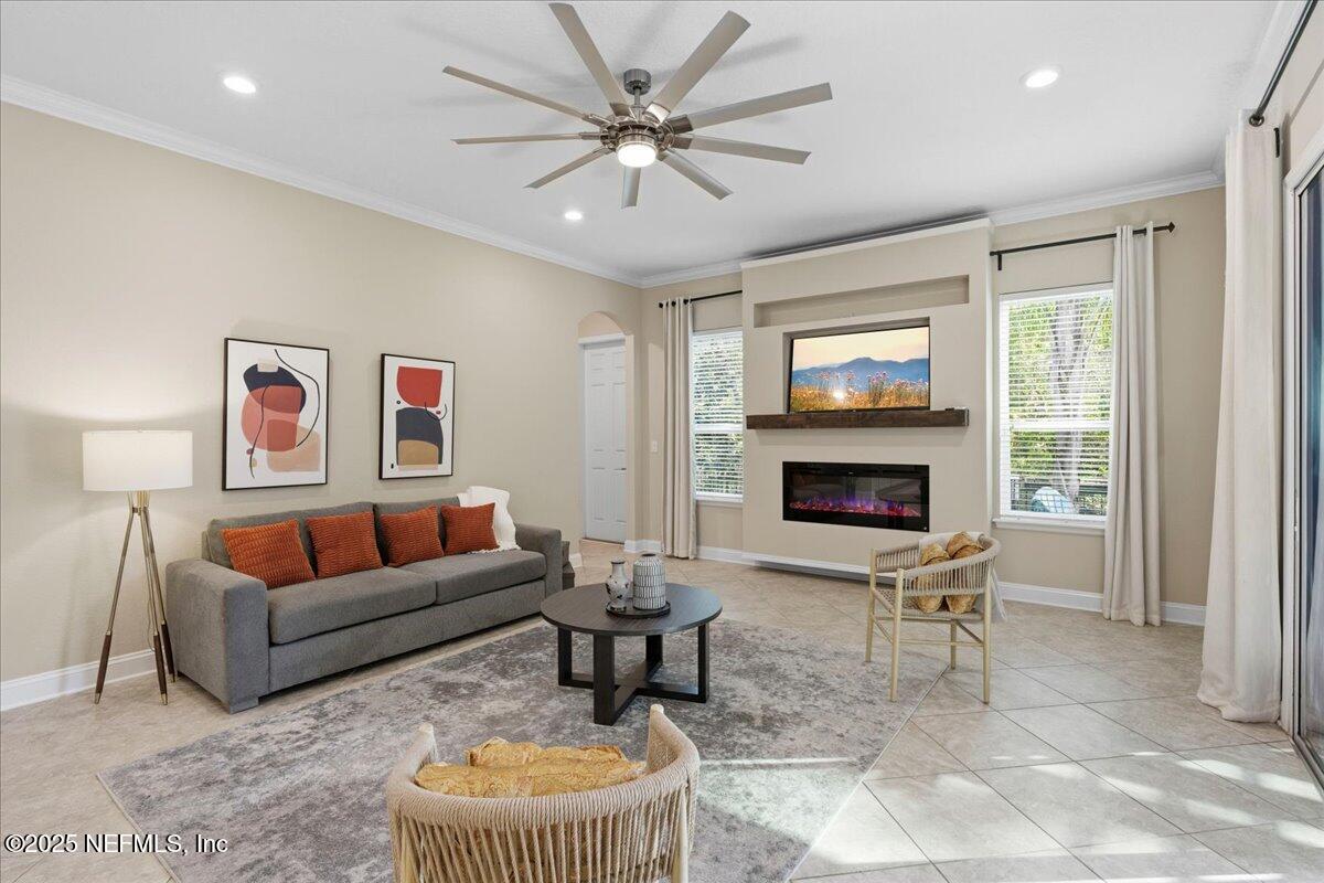 483 St Kitts Loop St. Augustine, FL 32092 - Photo 18 of 52 a living room with furniture and a fireplace
