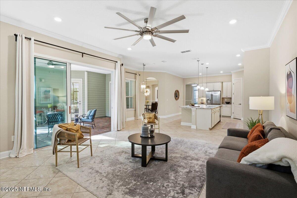 483 St Kitts Loop St. Augustine, FL 32092 - Photo 19 of 52 a living room with furniture and a large window