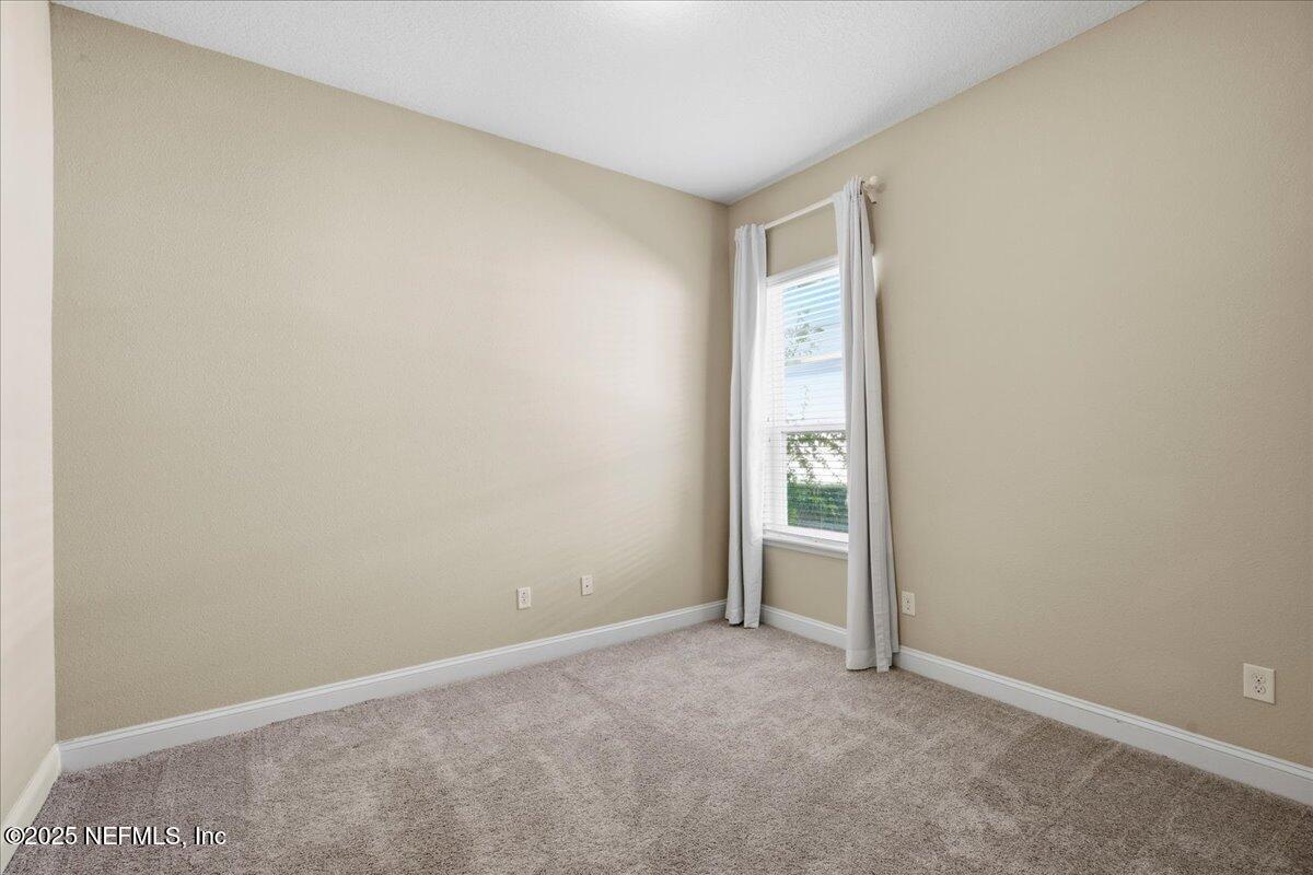 483 St Kitts Loop St. Augustine, FL 32092 - Photo 28 of 52 a view of an empty room with window