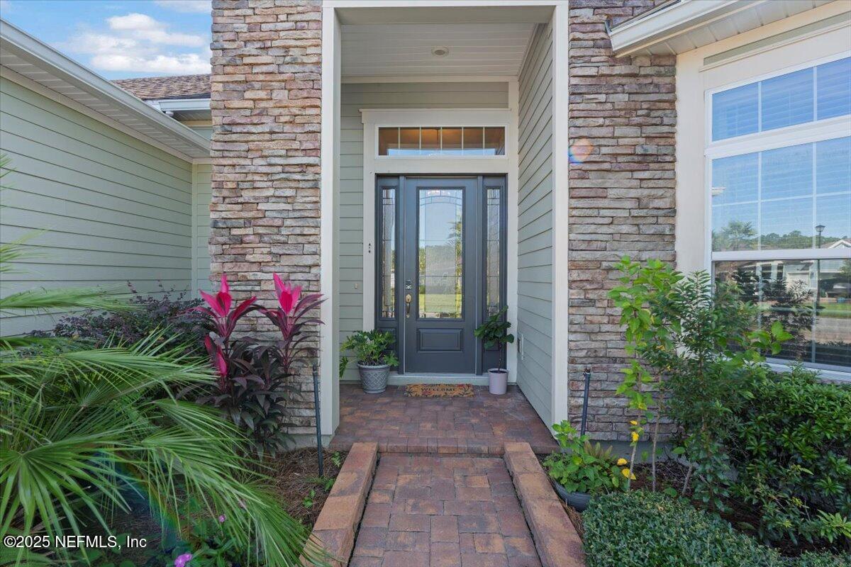 483 St Kitts Loop St. Augustine, FL 32092 - Photo 3 of 52 a front view of a house with a porch