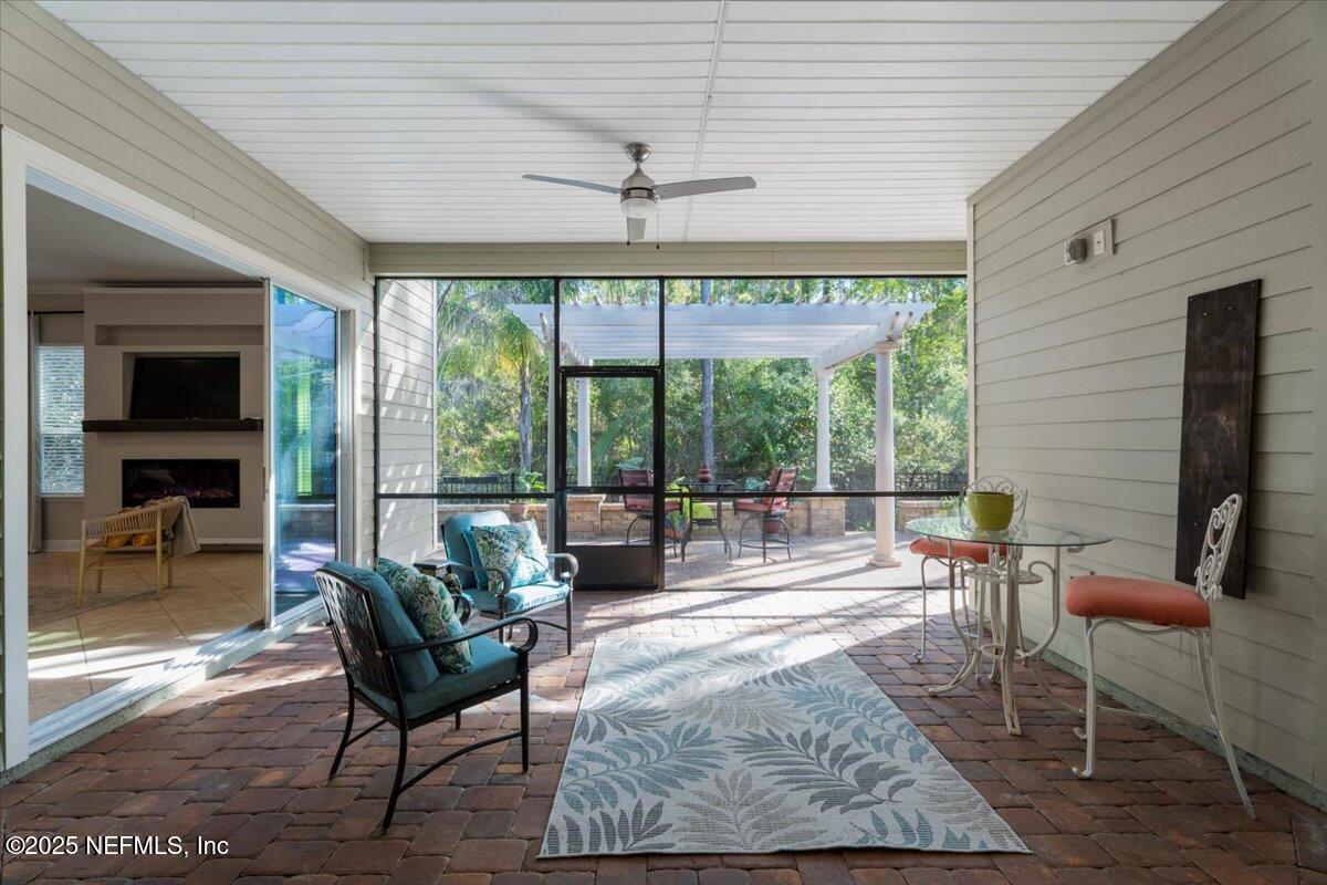 483 St Kitts Loop St. Augustine, FL 32092 - Photo 35 of 52 a living room with furniture and a large window