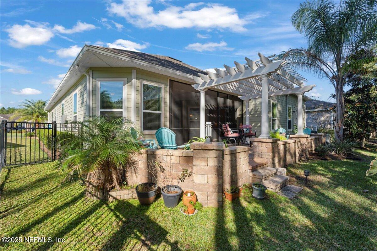 483 St Kitts Loop St. Augustine, FL 32092 - Photo 39 of 52 a view of a house with patio yard and patio