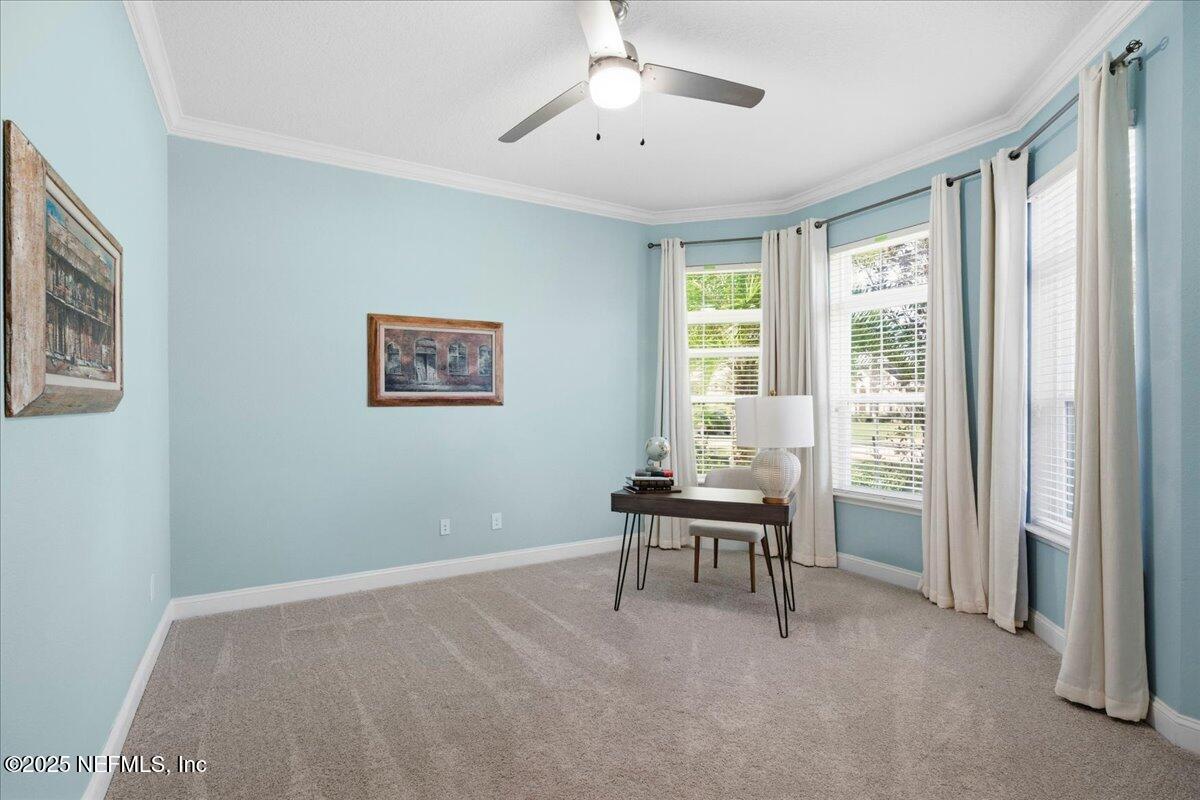 483 St Kitts Loop St. Augustine, FL 32092 - Photo 10 of 52 a workspace with wooden floor and a window