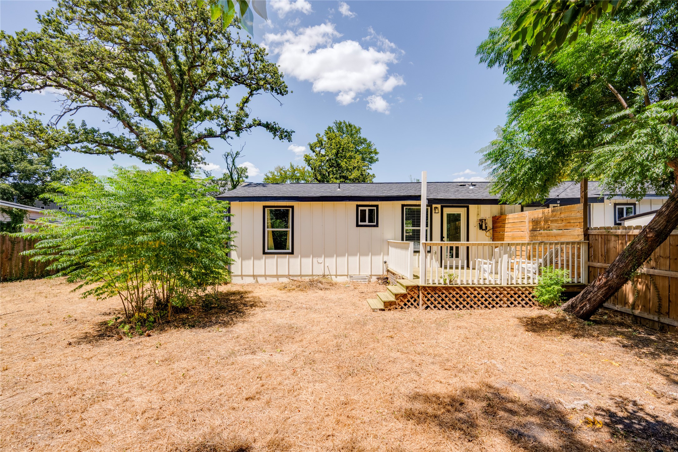 1400 Marcus Place, Unit B Austin, TX 78721 - Photo 34 of 39 A quaint backyard deck offers a peaceful retreat for outdoor leisure and entertaining.
