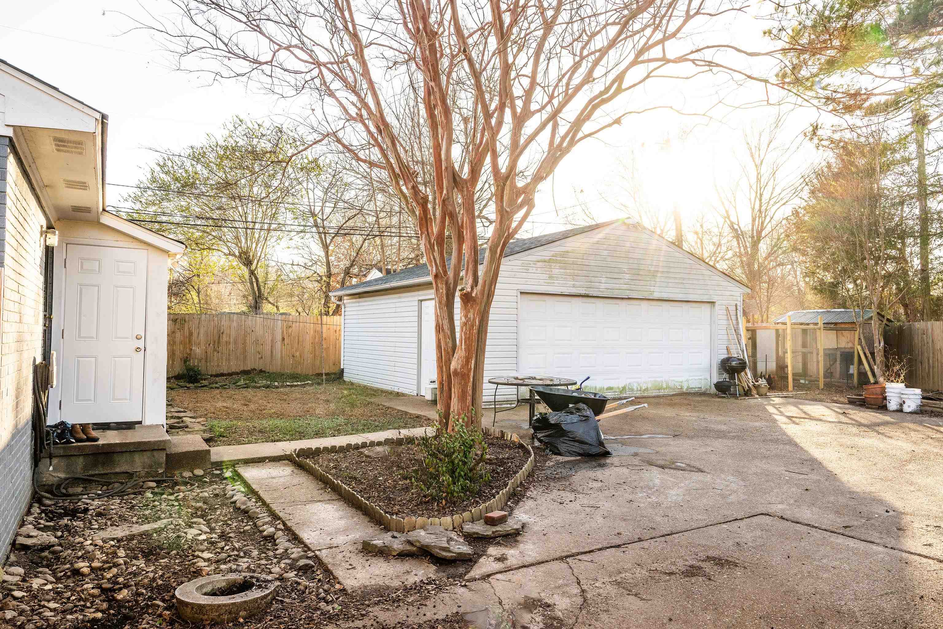 465 McDermitt Road Memphis, TN 38120 - Photo 13 of 14 2 car garage, large parking pad, and attached laundry closet all located behind a secure double gate in the fully fenced backyard.