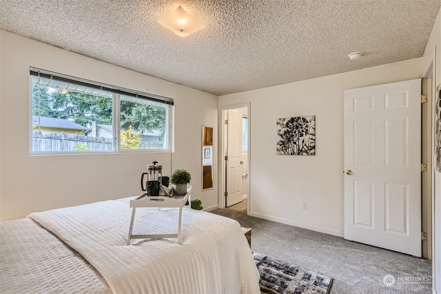 22020 6th Avenue West Bothell, WA 98021 - Photo 17 of 28 a bedroom with a bed and a window