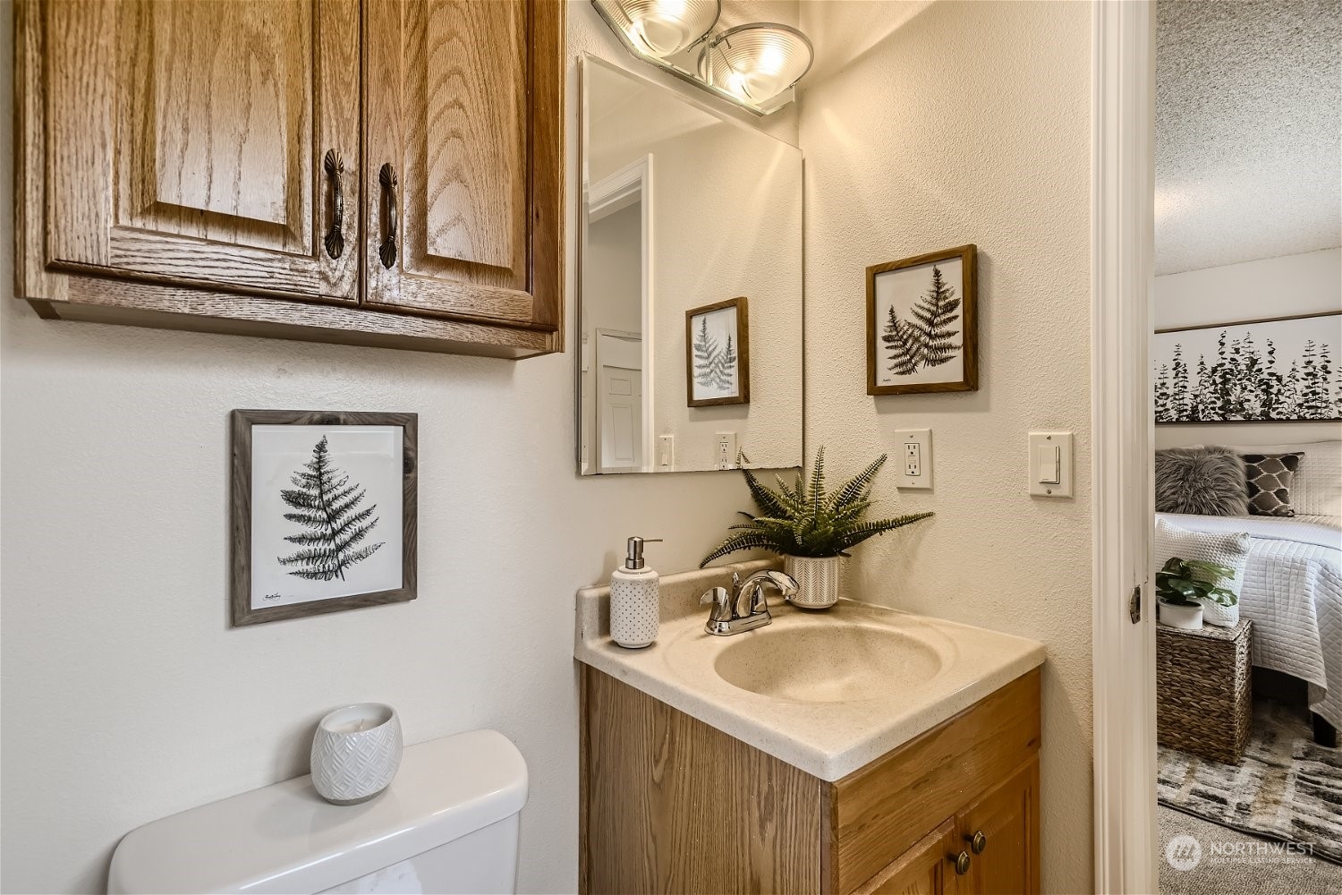 22020 6th Avenue West Bothell, WA 98021 - Photo 19 of 28 a bathroom with a sink a mirror and a toilet