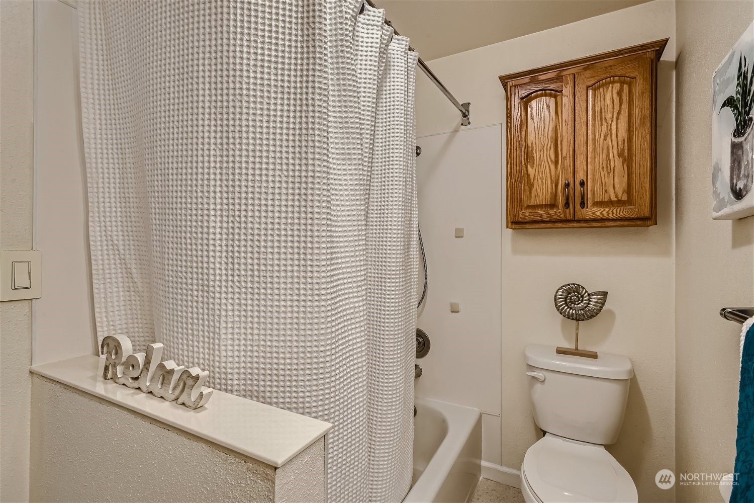 22020 6th Avenue West Bothell, WA 98021 - Photo 23 of 28 a bathroom with a toilet a sink and mirror