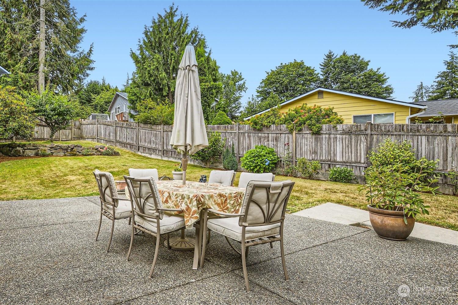 22020 6th Avenue West Bothell, WA 98021 - Photo 25 of 28 a view of a chairs and table in the patio with a swimming pool