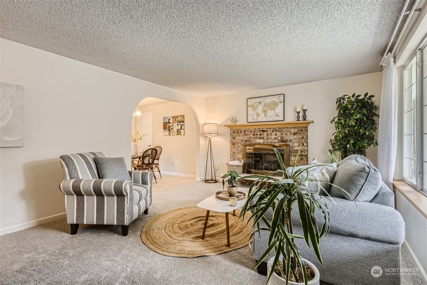 22020 6th Avenue West Bothell, WA 98021 - Photo 5 of 28 a living room with furniture and a fireplace
