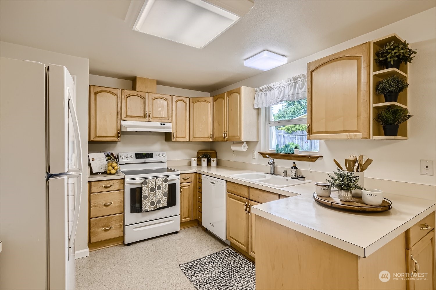 22020 6th Avenue West Bothell, WA 98021 - Photo 6 of 28 a kitchen with a sink stove and cabinets