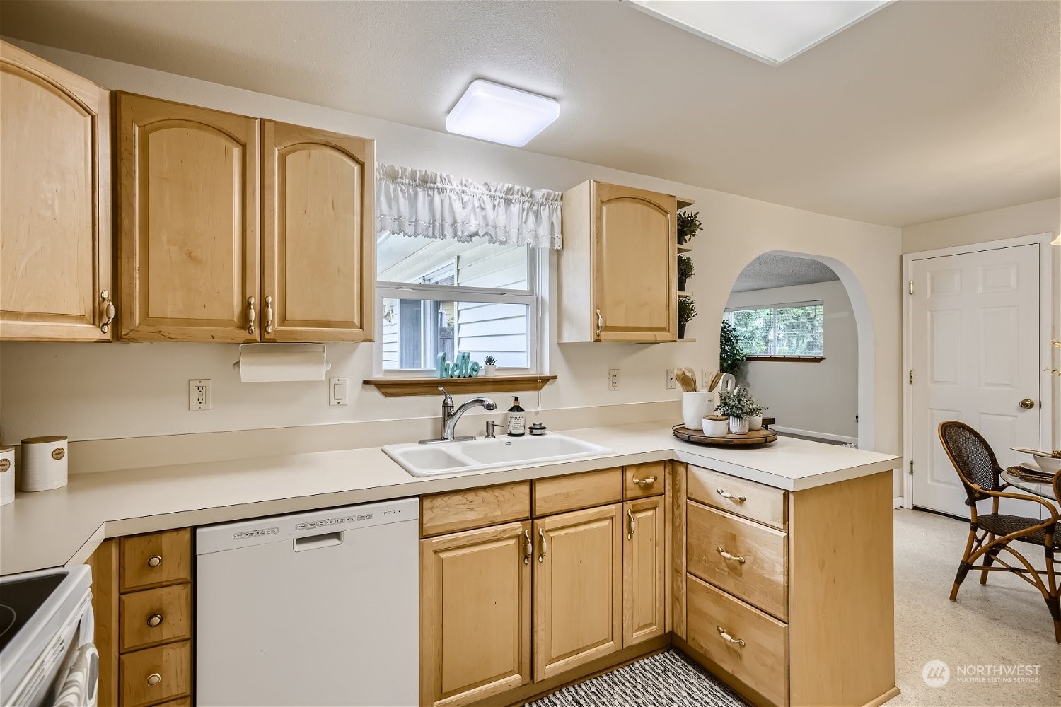 22020 6th Avenue West Bothell, WA 98021 - Photo 7 of 28 a kitchen with sink and mirror