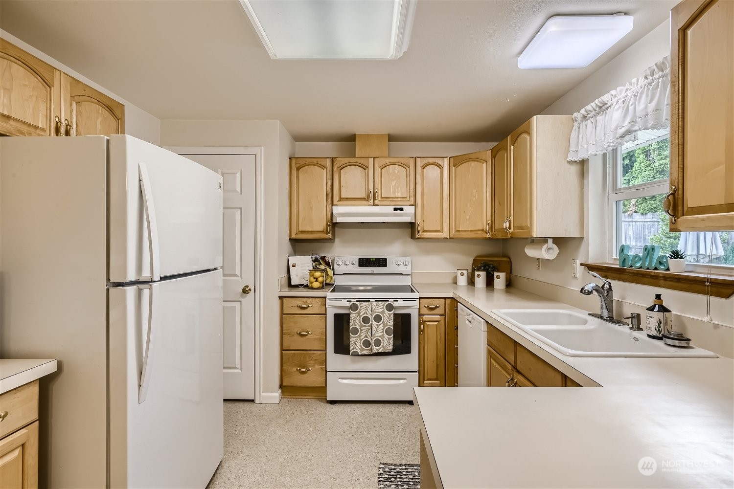 22020 6th Avenue West Bothell, WA 98021 - Photo 9 of 28 a kitchen with stainless steel appliances granite countertop a refrigerator sink and stove