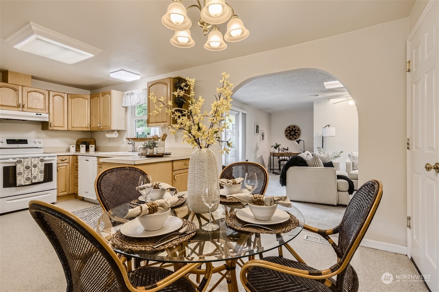 22020 6th Avenue West Bothell, WA 98021 - Photo 10 of 28 a dining room with furniture a chandelier and kitchen view