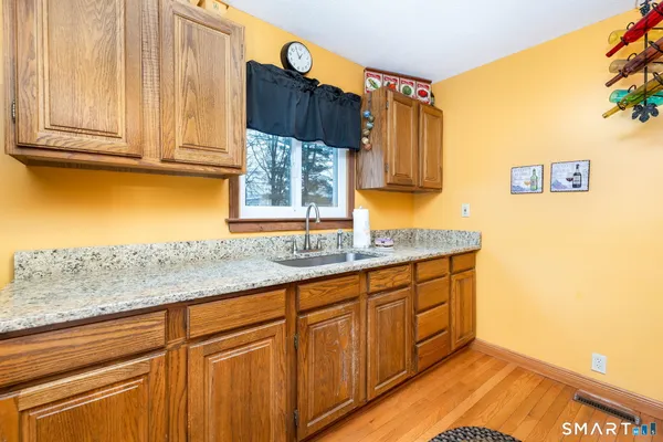 a kitchen with stainless steel appliances granite countertop a sink and a cabinets