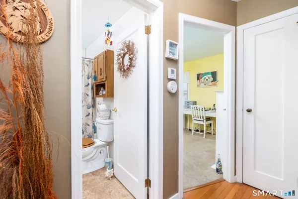 a bathroom with a sink toilet and a mirror