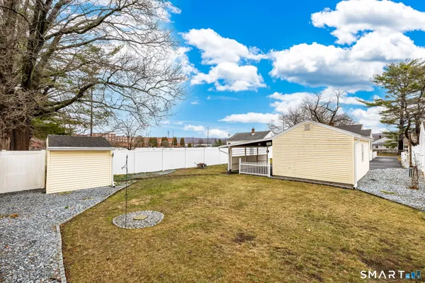 a side view of a house with a patio