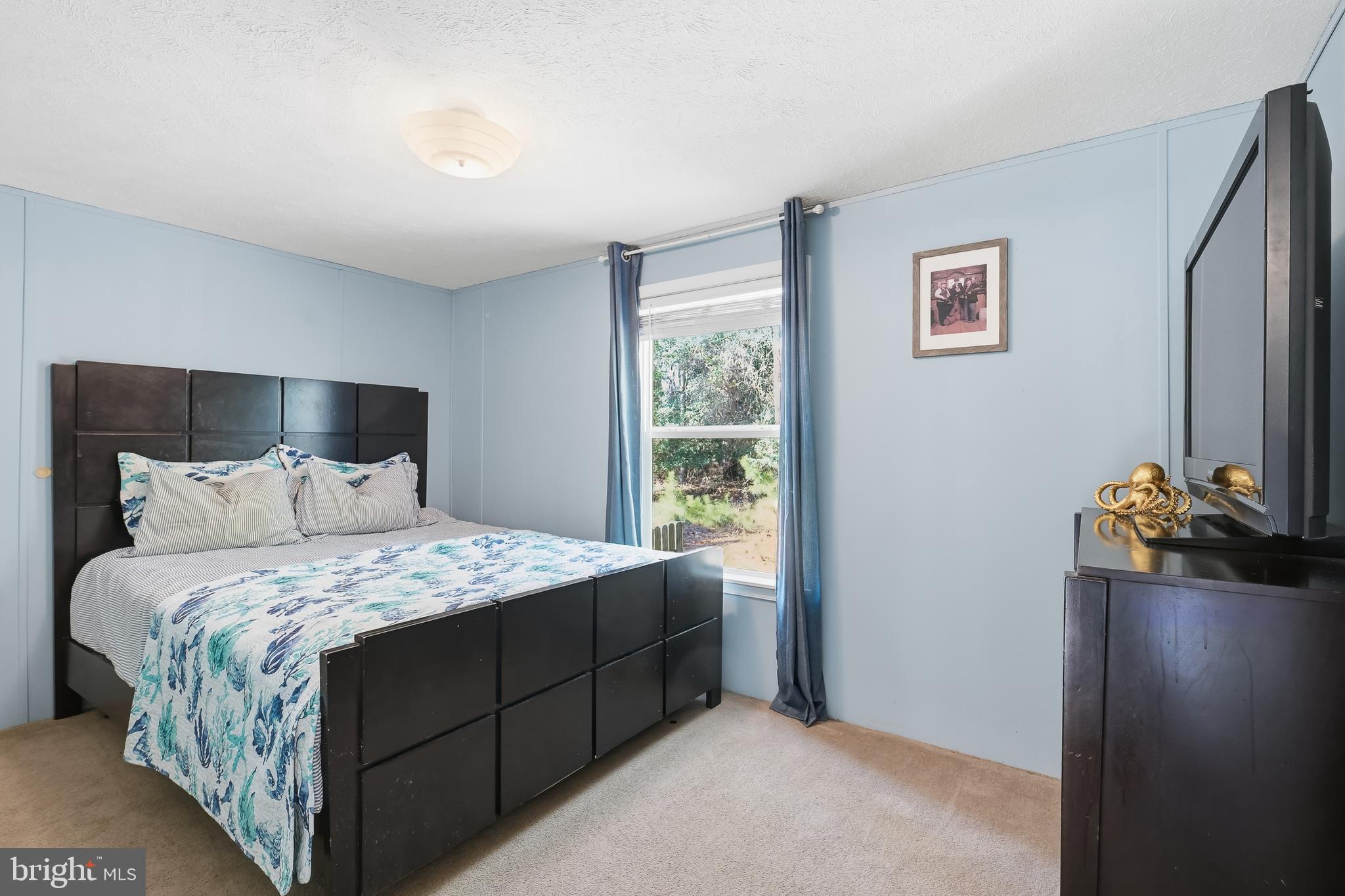 35390 Teal Road, Unit 314 Millsboro, DE 19966 - Photo 14 of 23 a bedroom with a bed and a window