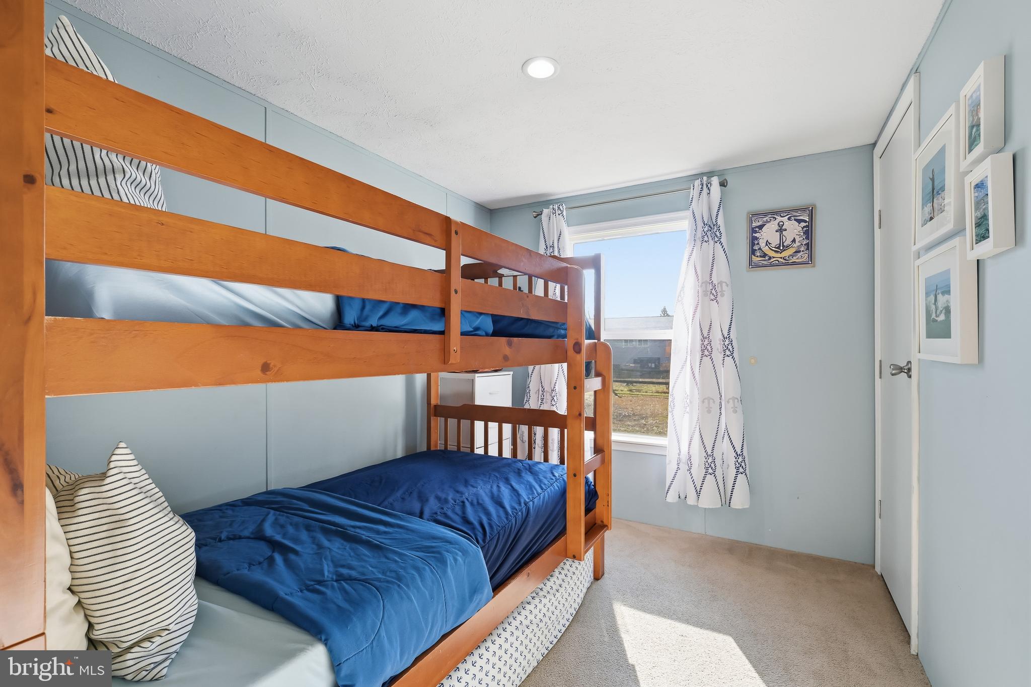 35390 Teal Road, Unit 314 Millsboro, DE 19966 - Photo 18 of 23 a bedroom with furniture and a window