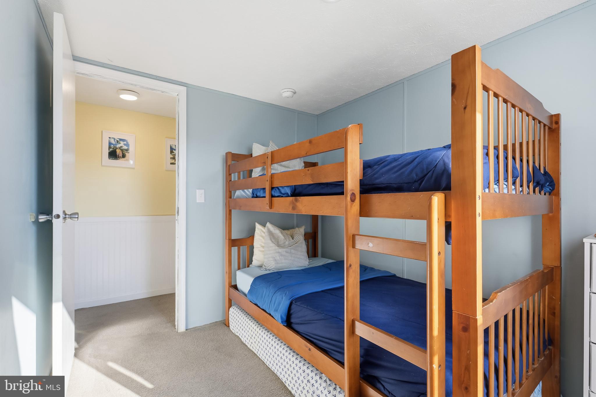 35390 Teal Road, Unit 314 Millsboro, DE 19966 - Photo 19 of 23 a bedroom with a bunk bed and a dresser