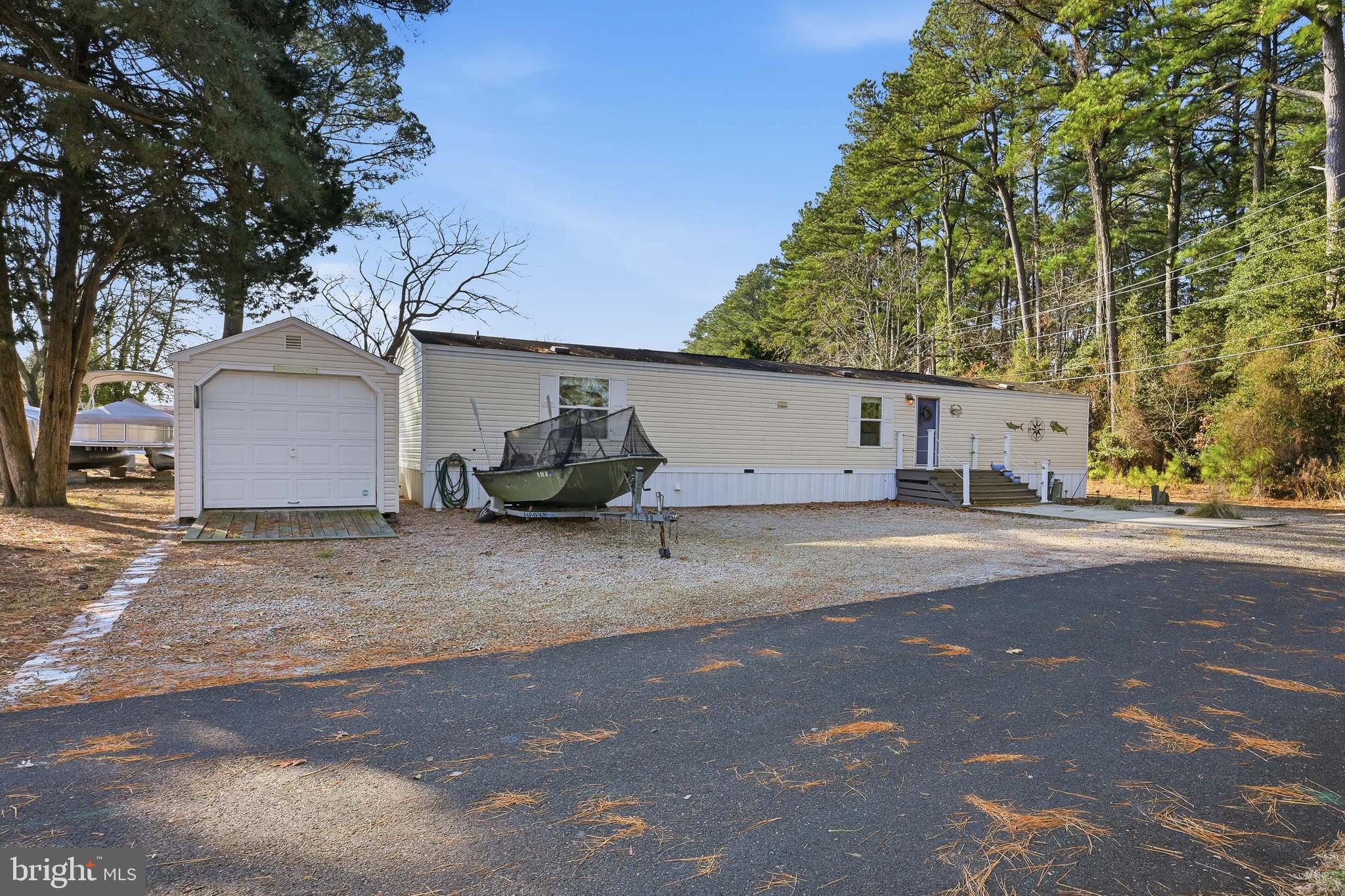35390 Teal Road, Unit 314 Millsboro, DE 19966 - Photo 2 of 23 a view of a street with a house