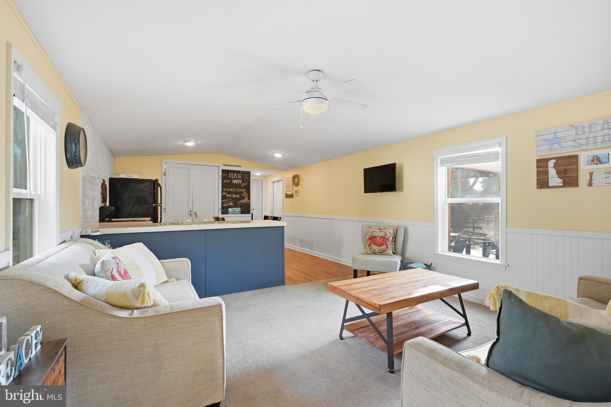 35390 Teal Road, Unit 314 Millsboro, DE 19966 - Photo 4 of 23 a living room with furniture and a large window