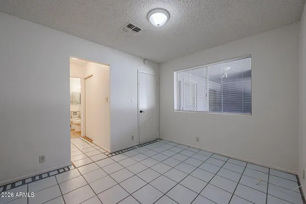a bathroom with a toilet a sink and a large mirror