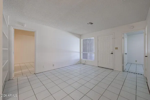 a view of kitchen and refrigerator