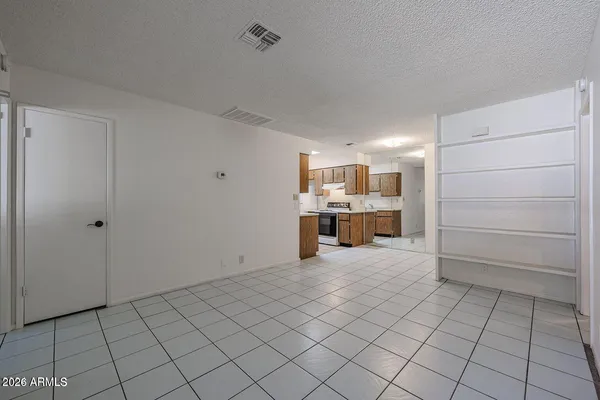 a kitchen with a sink cabinets and window