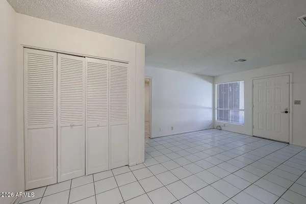 a view of an empty room and window