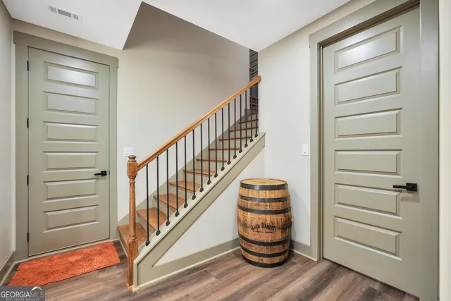 a spacious bathroom with a double vanity sink and mirror