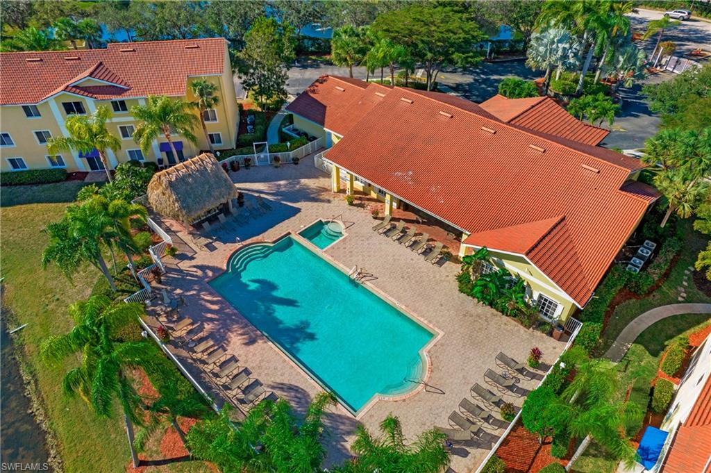8244 Key Royal Circle, Unit 615 Naples, FL 34119 - Photo 14 of 23 View from above of property with a pool