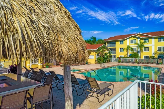 a view of a chairs and table in the patio