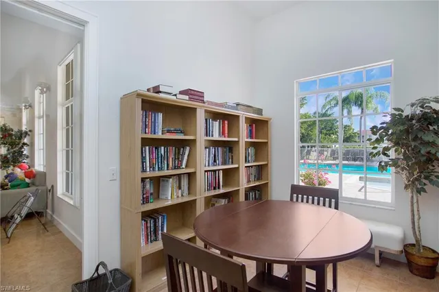 a view of a livingroom with furniture and a potted plant