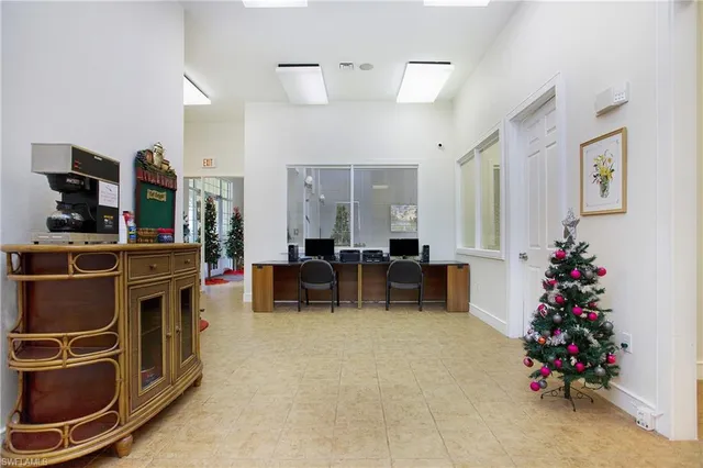 a living room with furniture and flowers