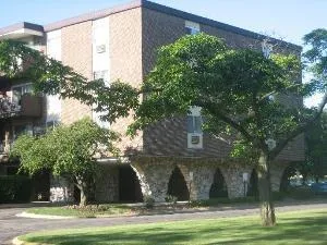 a view of swimming pool with a yard and plants