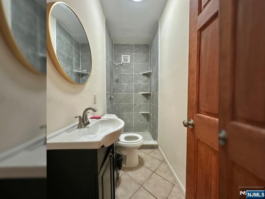 270 Pacific Street, Unit 3 Paterson, NJ 07503 - Photo 7 of 8 a bathroom with a sink and a mirror