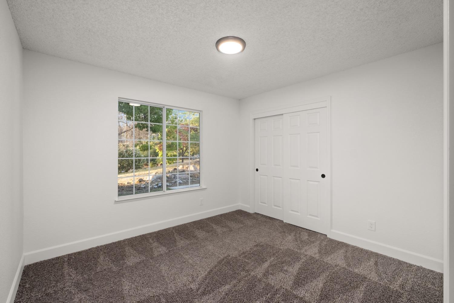 42906 Ranger Cir Drive Coarsegold, CA 93614 - Photo 16 of 29 a view of a room that has a window in it