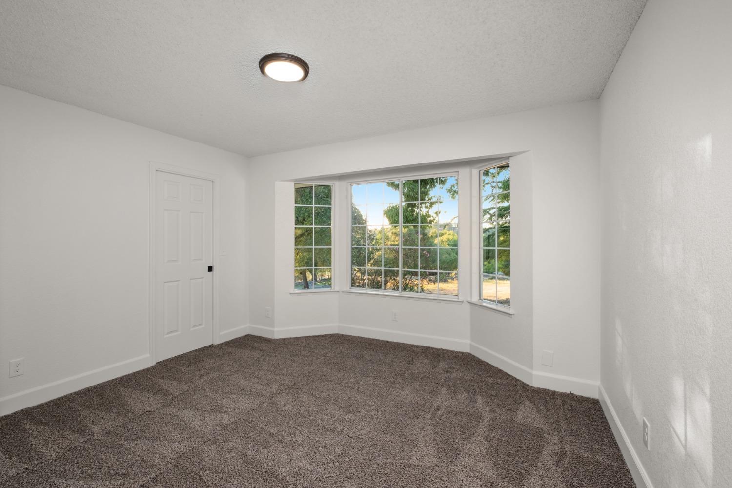 42906 Ranger Cir Drive Coarsegold, CA 93614 - Photo 18 of 29 a view of an empty room with a window
