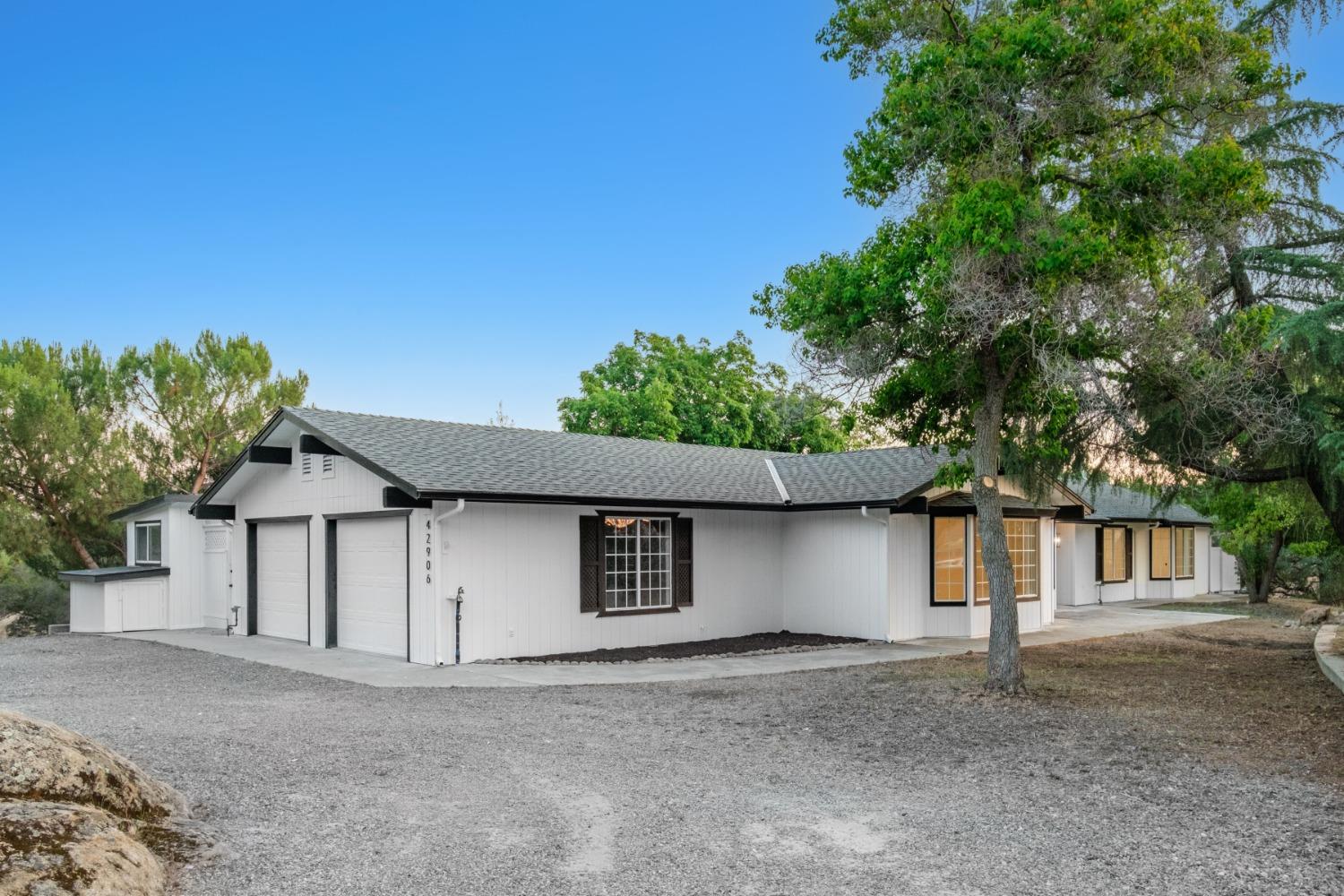 42906 Ranger Cir Drive Coarsegold, CA 93614 - Photo 2 of 29 a house with trees in the background