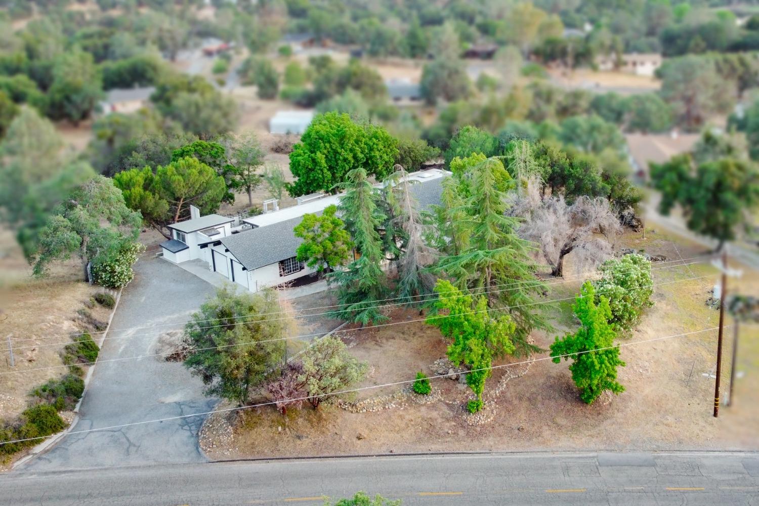 42906 Ranger Cir Drive Coarsegold, CA 93614 - Photo 26 of 29 an aerial view of a house with a yard and greenery