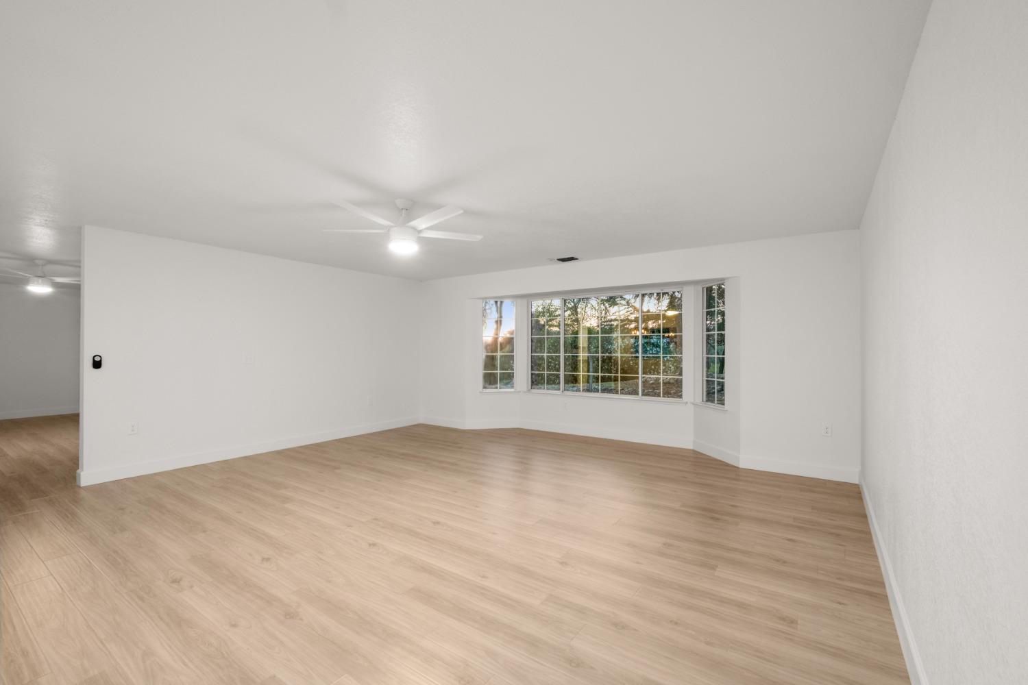 42906 Ranger Cir Drive Coarsegold, CA 93614 - Photo 6 of 29 wooden floor in an empty room with a window