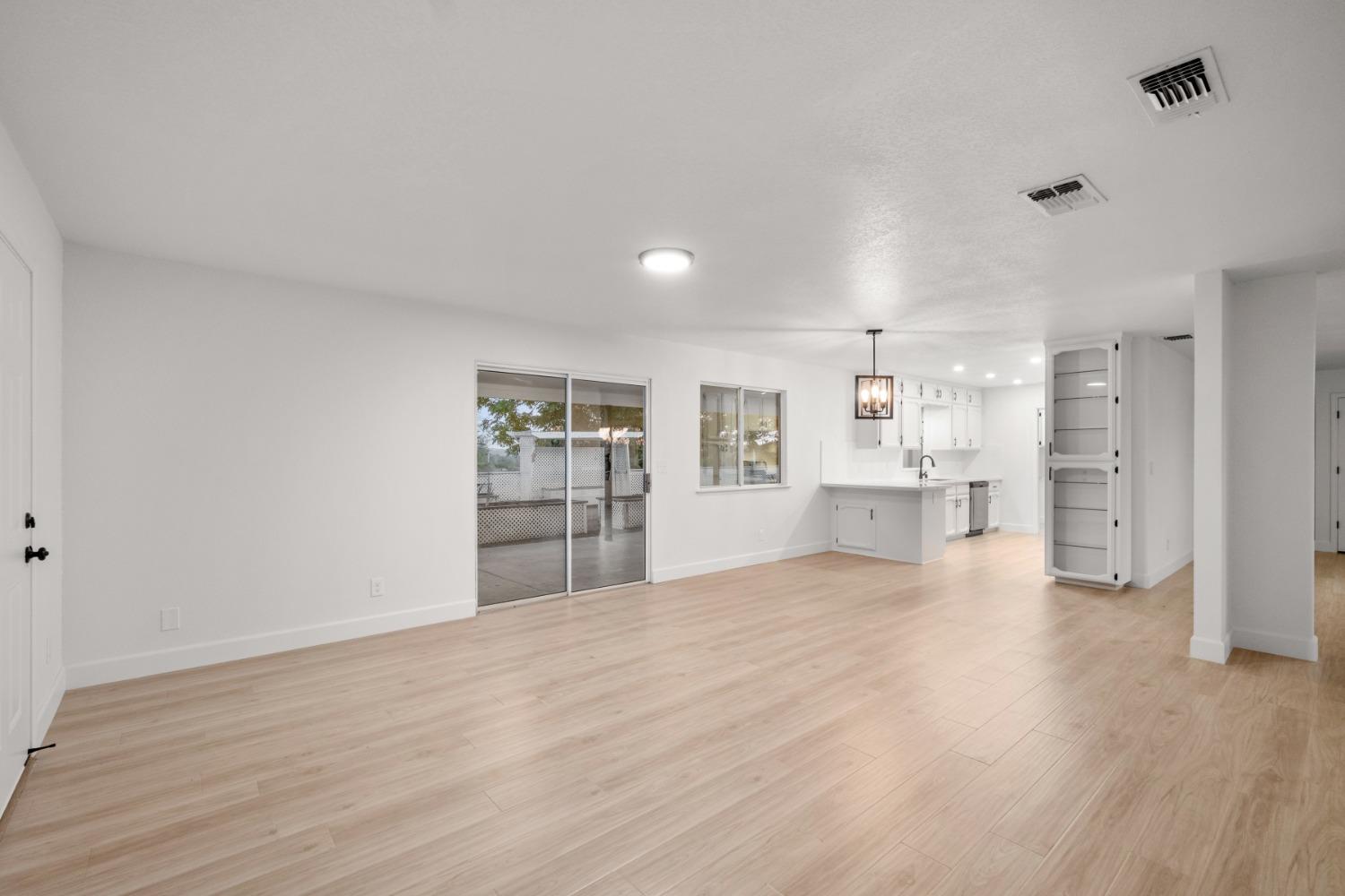 42906 Ranger Cir Drive Coarsegold, CA 93614 - Photo 7 of 29 a view of a kitchen with refrigerator and wooden floor